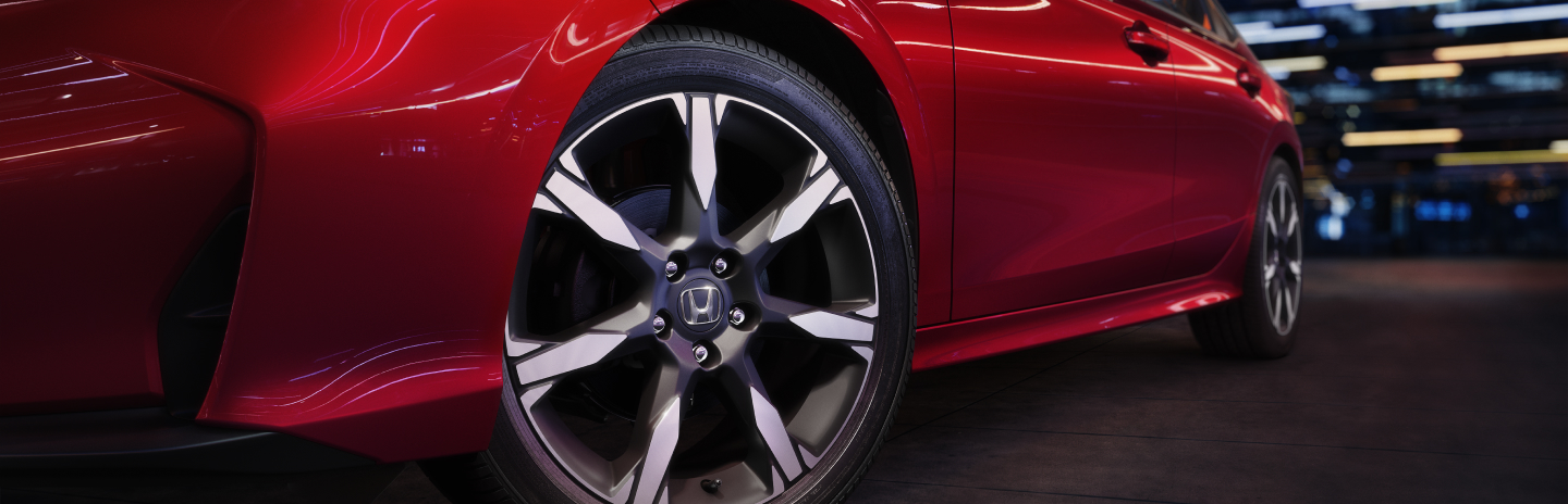 Red Honda Civic Sedan at night on road